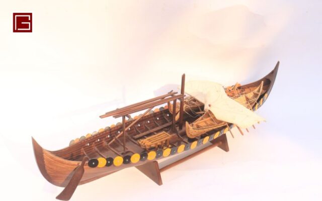 The wooden Gokstad ship model, handcrafted by the skilled hands of Vietnamese artisans, is proudly displayed at the Gia Nhien wooden ship showroom.